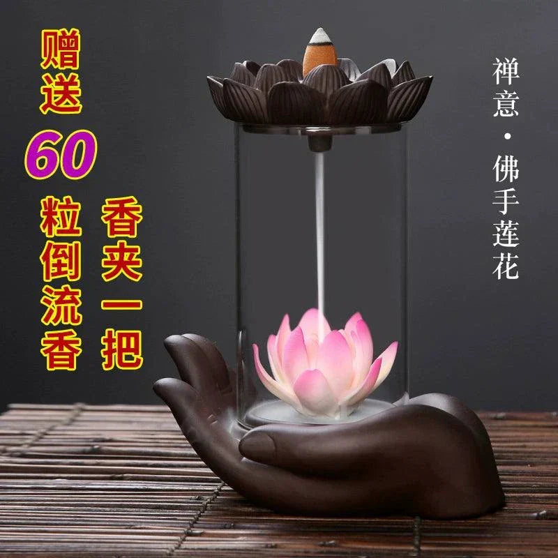 Backflow purple sand ceramic incense burner with lotus flower and Buddha's hand design on wooden surface