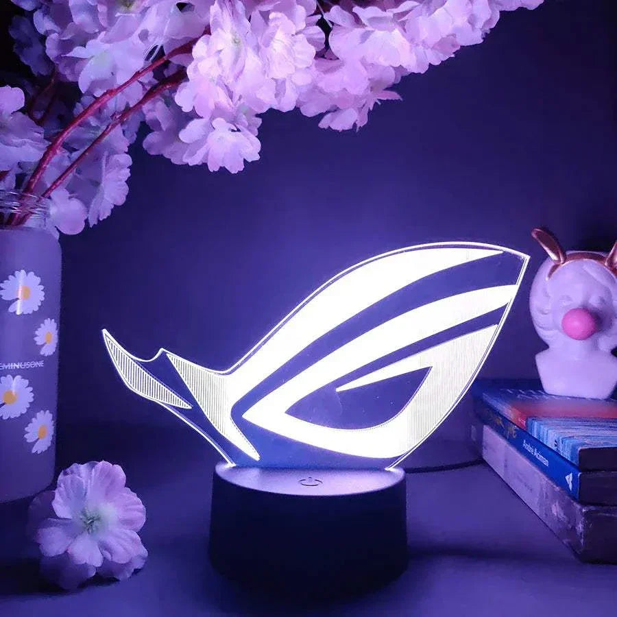 ROG 3D LED lamp with black base illuminated in white light for gaming setup decor