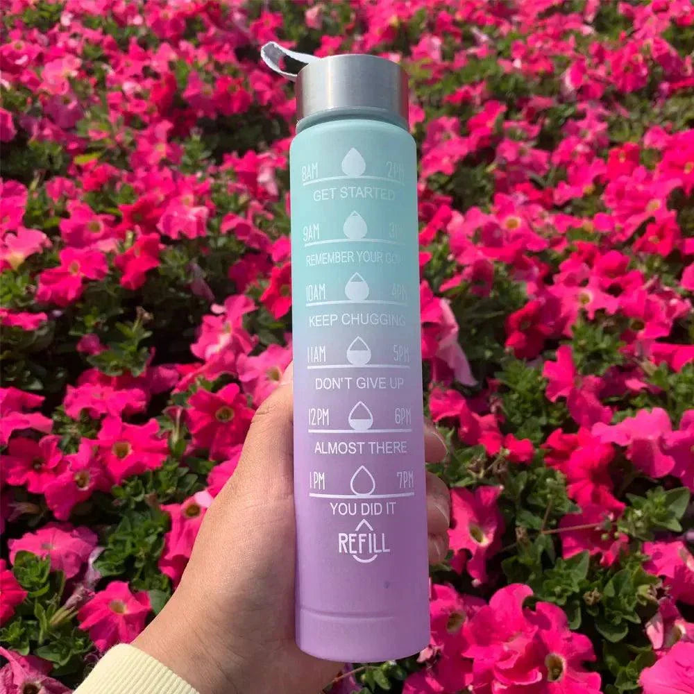 Reusable water bottle with motivational quotes and time markers, gradient purple-blue design, leakproof with straw, eco-friendly plastic, ideal for sports and daily hydration.