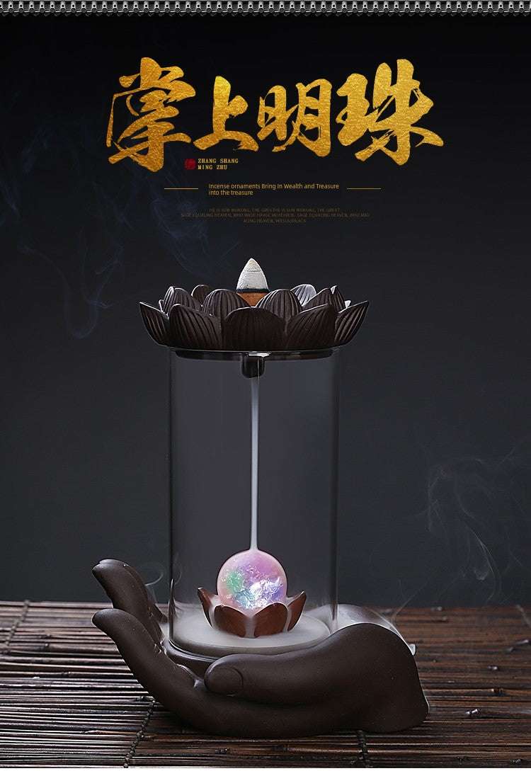 Backflow Purple Sand incense burner with Zen glass lotus and Buddha's hand design on a ceramic hand base
