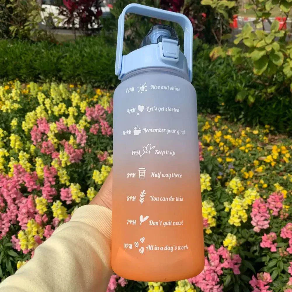Gradient sports water bottle with motivational quotes and time markers, leakproof with a straw mouth, reusable eco-friendly plastic design.