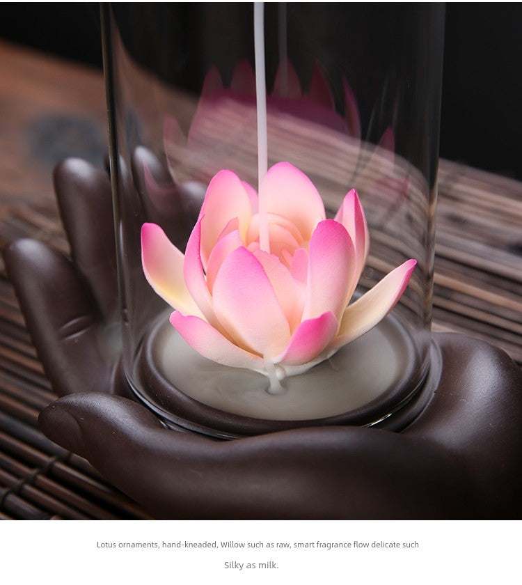 Backflow purple sand incense burner with pink lotus flower and hand-shaped ceramic base under glass cover