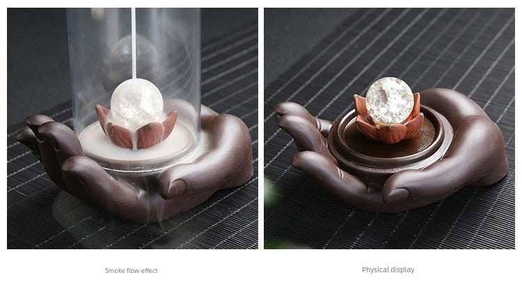 Backflow purple sand incense burner with glass orb on lotus held by ceramic Buddha hand decoration