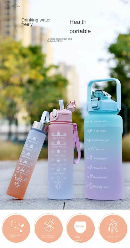 Set of reusable sports water bottles with motivational quotes and time markers, available in pastel colors with straw and leakproof lids.