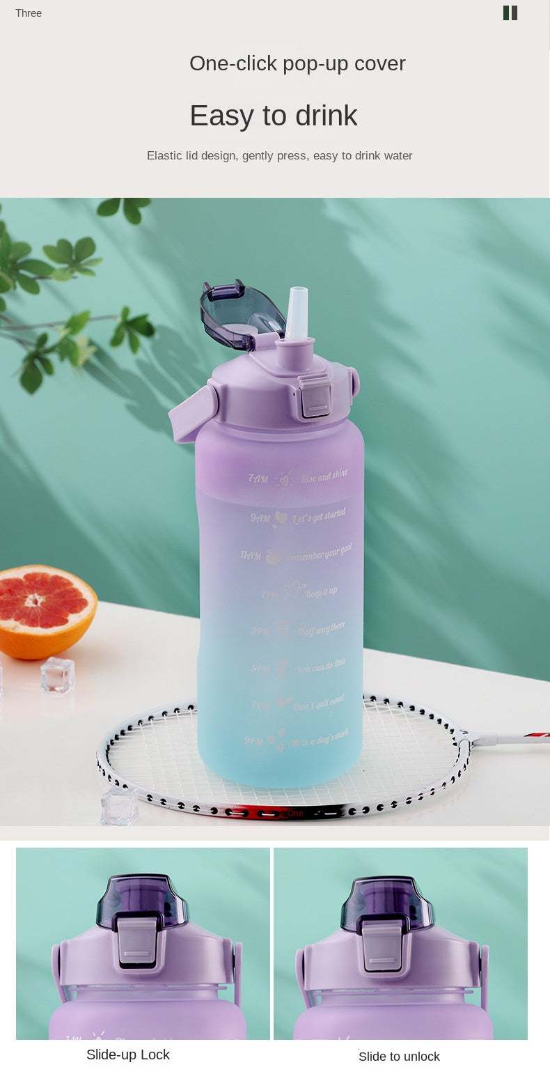 Purple sports water bottle with motivational quotes and time marker, featuring a pop-up straw lid and leak-proof design.
