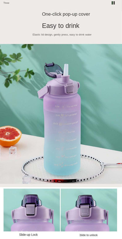 Purple sports water bottle with motivational quotes and time marker, featuring a pop-up straw lid and leak-proof design.
