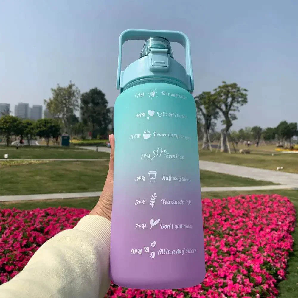 Reusable sports water bottle with time markers and motivational quotes in blue to purple gradient design
