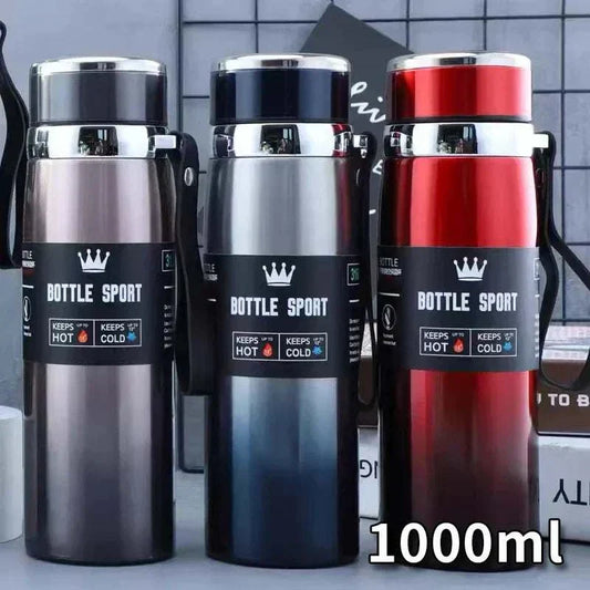 Set of three 1L stainless steel thermal water bottles in gray, black, and red with insulated design to keep drinks hot or cold.