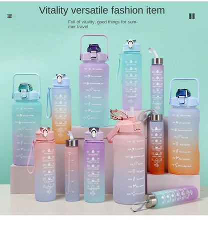Colorful reusable sports water bottles with motivational quotes and time markers, featuring leakproof lids and straw options, made of BPA-free plastic.