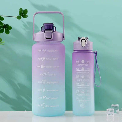 Purple and blue gradient sports water bottles with motivational quotes and time markers, featuring leakproof lids and straw drinking spouts.