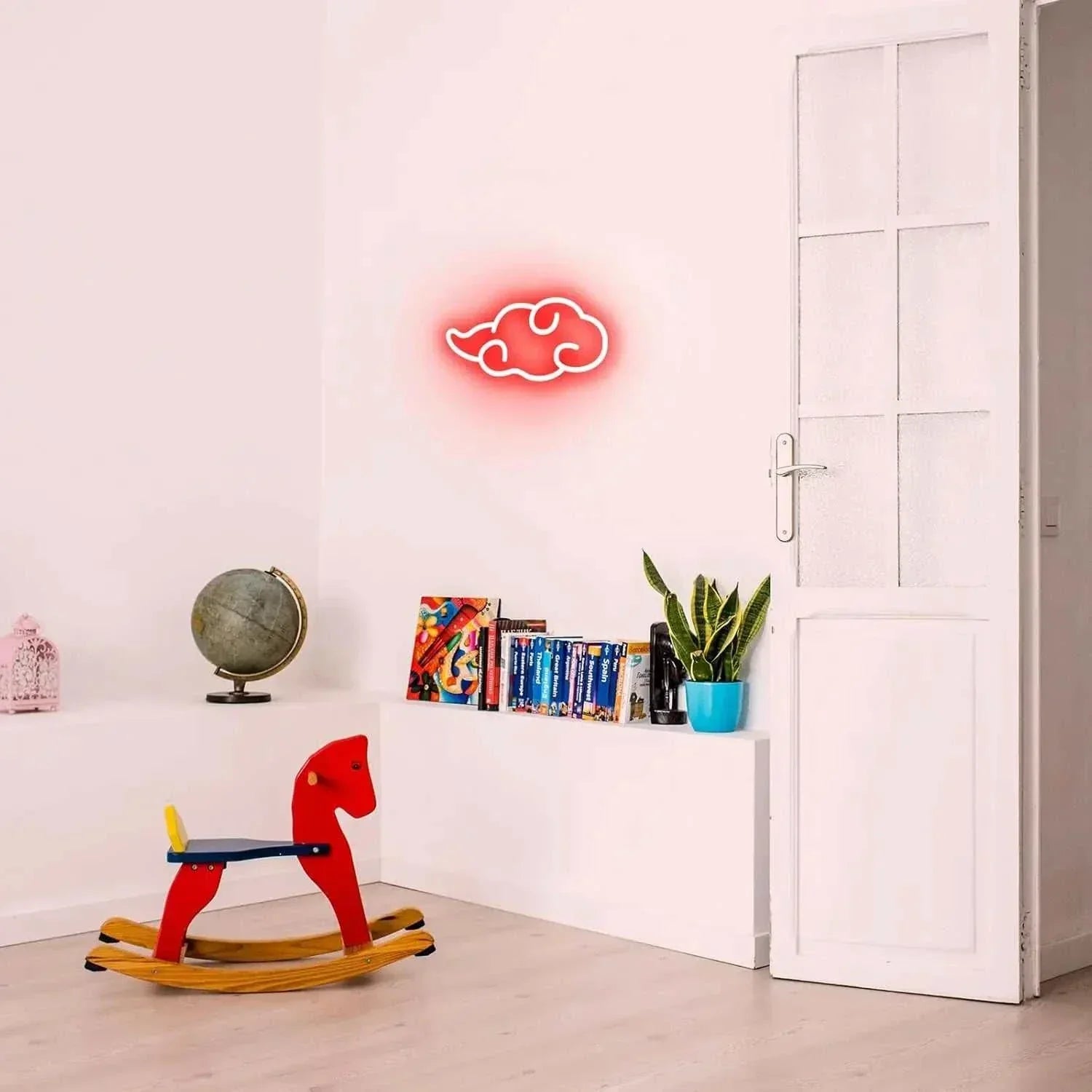 Akatsuki Cloud Neon LED wall sign glowing red in minimalist room with rocking horse and bookshelf