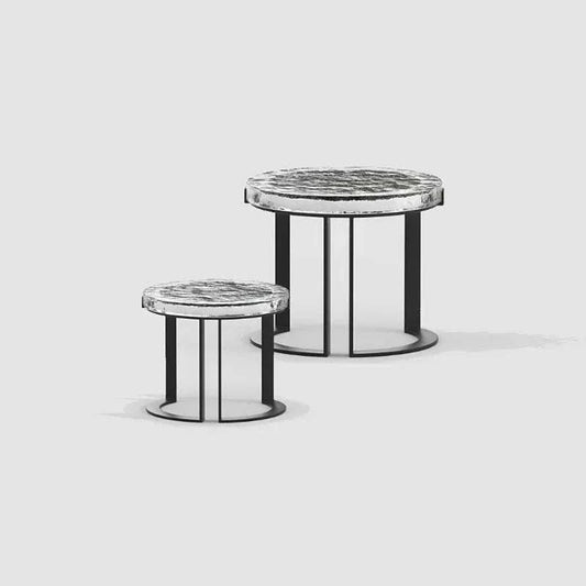 Set of two modern round outdoor garden tables with marble-patterned tops and black metal bases