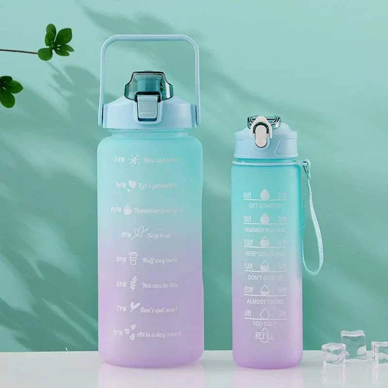 Two pastel gradient reusable water bottles with time markers and motivational quotes, designed for sports and hydration tracking.