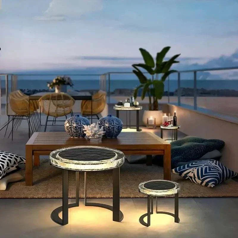 Solar powered outdoor garden table set with waterproof LED lights on rooftop patio at dusk