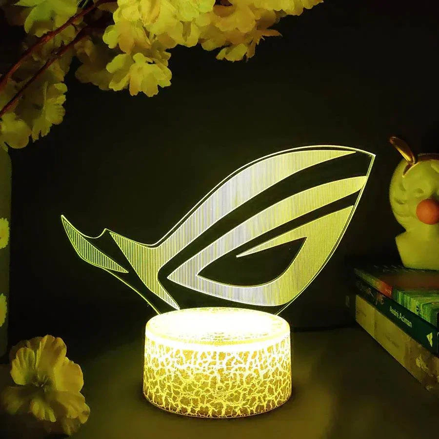 ROG 3D LED lamp with crack pattern lava lamp base glowing yellow in dark gaming setup