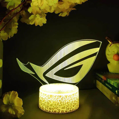 ROG 3D LED lamp with crack pattern lava lamp base glowing yellow in dark gaming setup