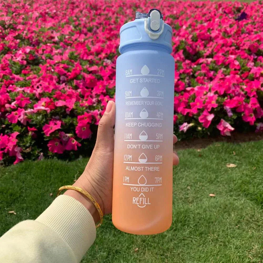Outdoor sports water bottle with motivational quotes and time markers, gradient blue to orange, reusable plastic with straw lid.