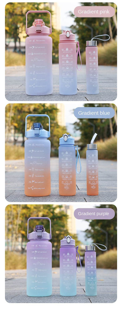 Set of reusable gradient-colored sports water bottles with motivational quotes and time markers, featuring leakproof lids, straw mouth, and easy-to-carry design for hydration tracking.